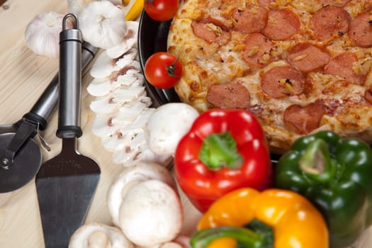 A couple of delicious pizzas, with raw tomatoes, green peppers and salami