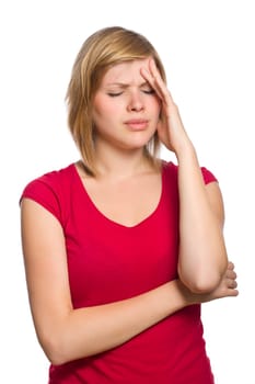 beautiful blonde female in red shirt is having a headache isolated on white