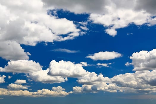 White clouds over blue sky - a great background image for many uses