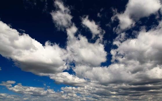 White clouds over blue sky - a great background image for many uses