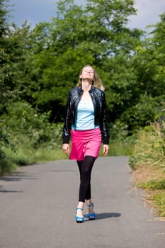 woman walking on pavement