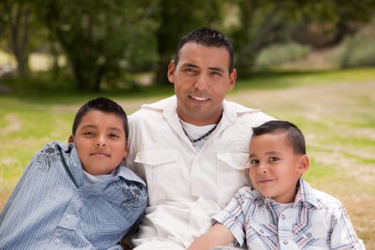 Father and Sons Portrait in the Park.