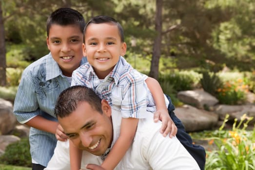 Father and Sons Portrait in the Park.