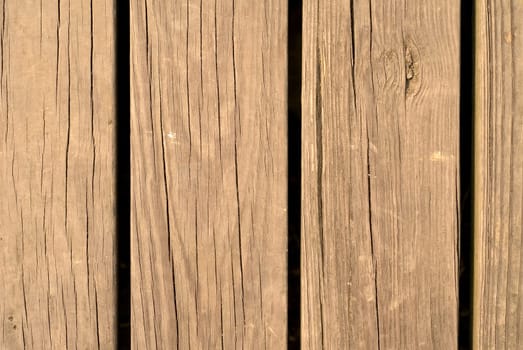 It is an old and brown wood wall.