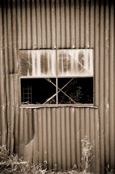 old rusty tin shed and window