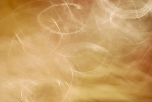 Abstract golden background with circular light patterns