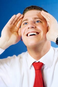 Young businessman  surprised looking up