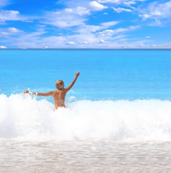 Beautiful young woman enjoying the Ionian sea in Greece