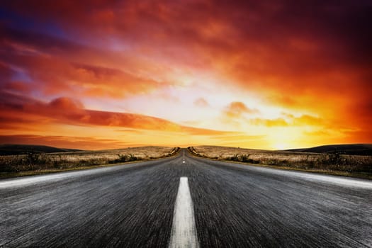 Road leading into a beautiful sunset