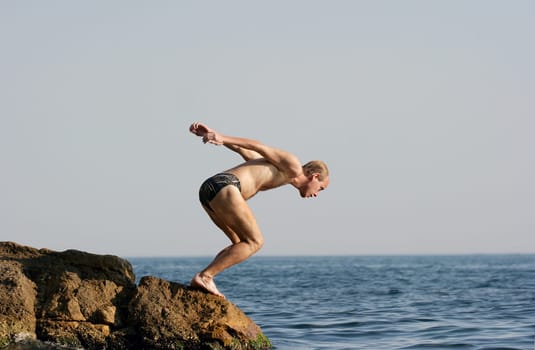 Man jumping into the sea