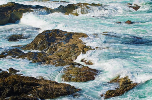 great image of strong waves splashing into the rocks