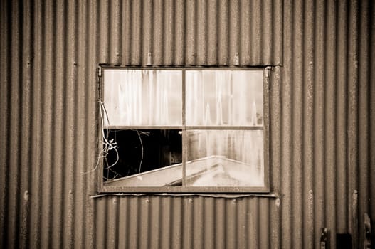 old rusty tin shed and window