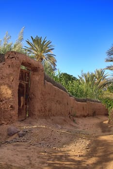 old gate in a clay fence in Morocco