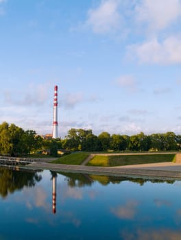 A factory chimney near water in Klaipeda, Lithuania