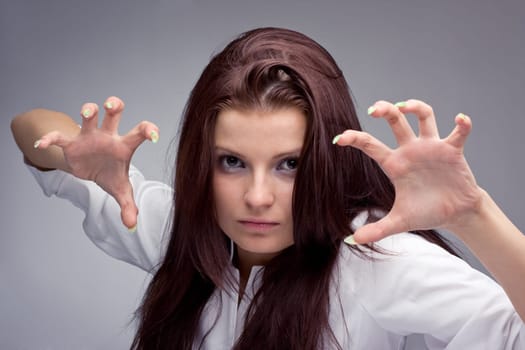 Portrait of a young aggressive woman