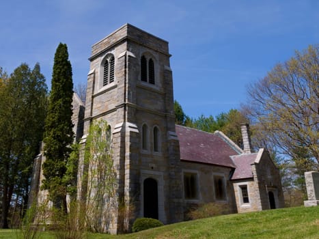 A stone chapel on a sunny Spring day.