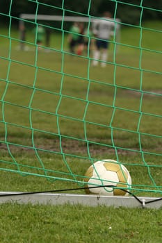 Photo of an soccer ball in a goal