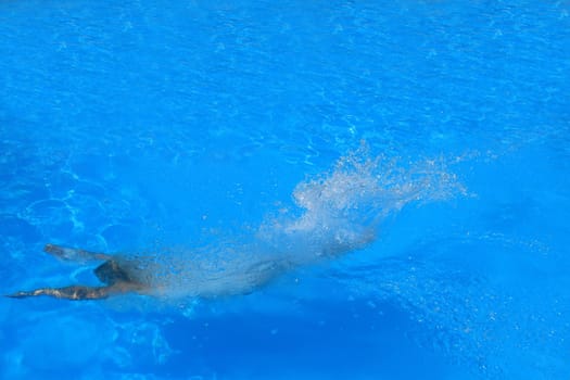 Pretty woman enjoying a swimming pool in Greece