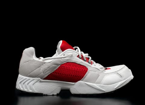 Training shoe isolated on black with reflection