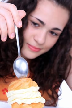 Young girl eating a yumy cake