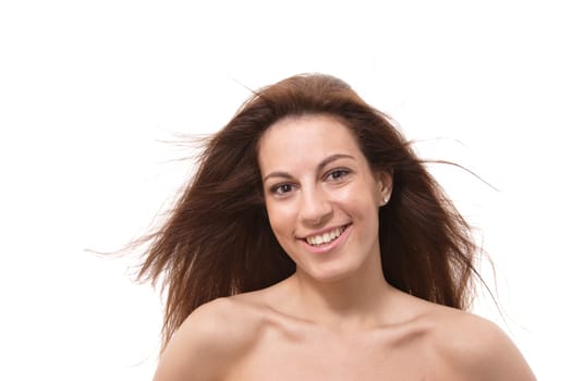 Closeup portrait of a happy young woman smiling isolated on white background