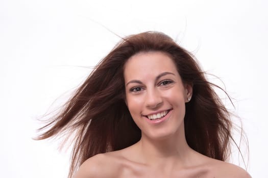 Closeup portrait of a happy young woman smiling isolated on white background