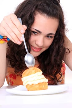 Young girl eating a yumy cake
