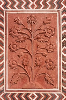 Detail of decoration on the mosque at the Taj Mahal. Mughal style building of red sandstone inlaid with marble. Agra, Uttar Pradesh, India