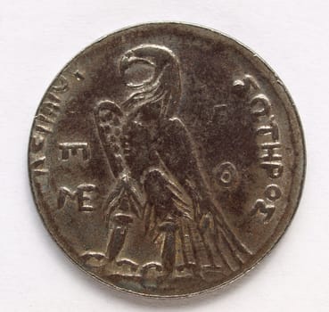 Ancient Greek coin on a clear background
