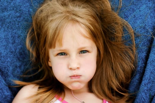 The little girl wIth an angry grimace