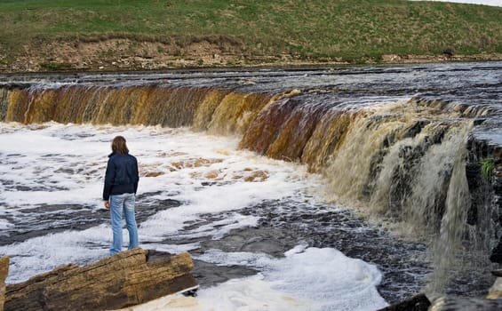 Waterfall of a northern river in spring
