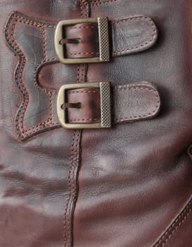 Two metal buckles on a product from a leather