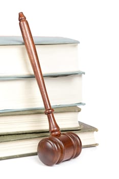 Wooden gavel from the court and law books isolated on white background. Shallow depth of field