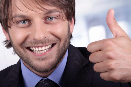 close-up of a happy businessman thumb-up