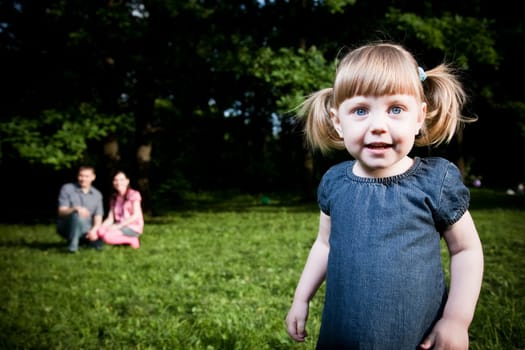 Little Girl Portrait On The Natire Background