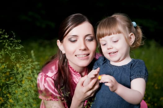 Mother And Daughter Close-Up Portrait Outdoors