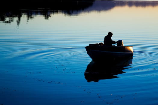 A man in a boat at Cline Spit in Sequim Washington.