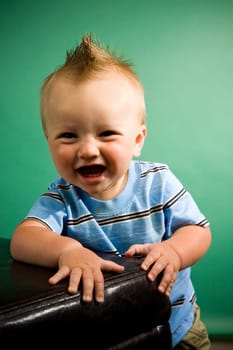 A portrait of a cute nine month old baby boy.