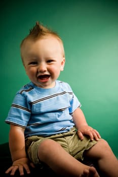 A portrait of a cute nine month old baby boy.
