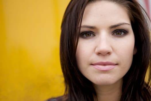 An Edgy Brunette with a yellow backround
