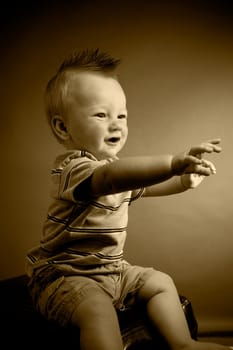 A portrait of a cute nine month old baby boy.