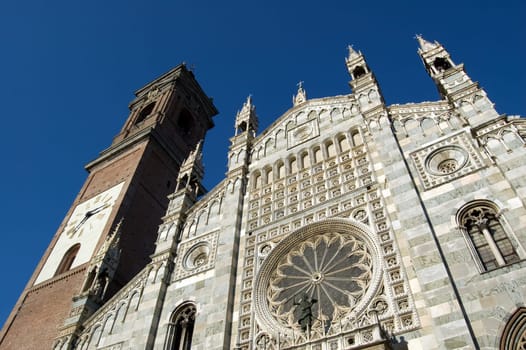 Duomo of Monza facade with the belfry and the rose window