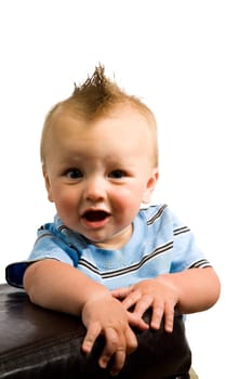 A portrait of a cute nine month old baby boy isolated on a while background.