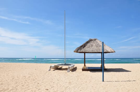 Boat on the empty Nusa Dua beach, Bali, Indonesia