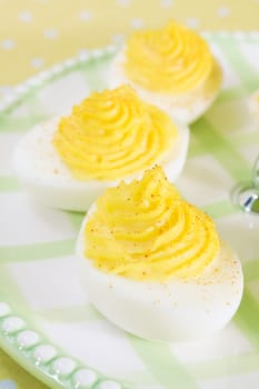 Deviled eggs sprinkled with paprika.