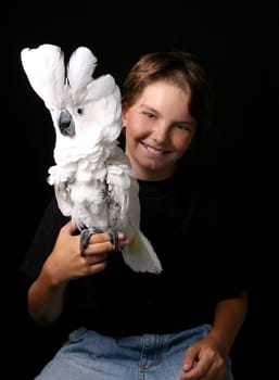 Young Child Holding His Pet Umbrella Cockatoo