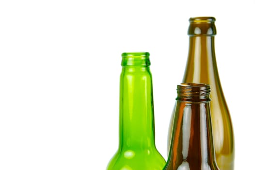 Empty beer bottles isolated against a white background