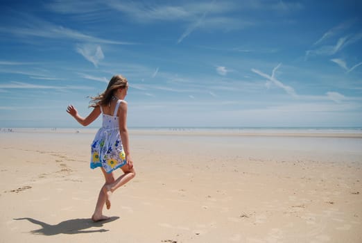 Young girl having fun on the beach