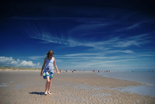 Young girl having fun on the beach