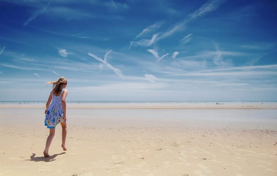 Young girl having fun on the beach